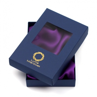 Small navy blue gift packaging with a window